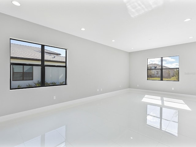 empty room with light tile patterned flooring