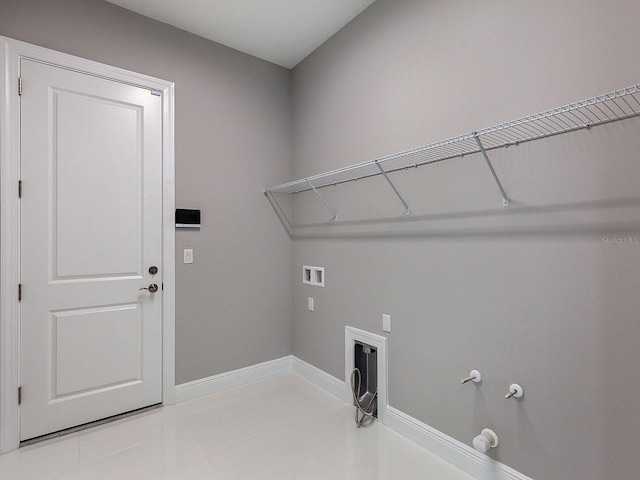 laundry area with tile patterned flooring, washer hookup, and hookup for a gas dryer