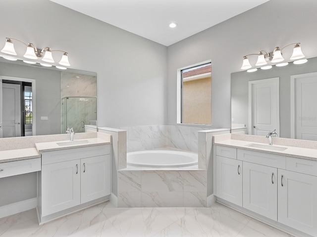 bathroom featuring plenty of natural light, vanity, and shower with separate bathtub