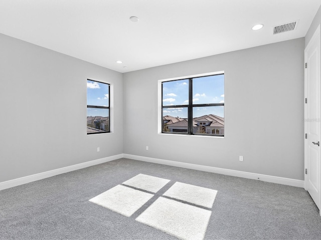 unfurnished room with carpet floors