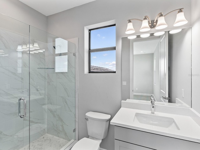 bathroom with vanity, toilet, and an enclosed shower