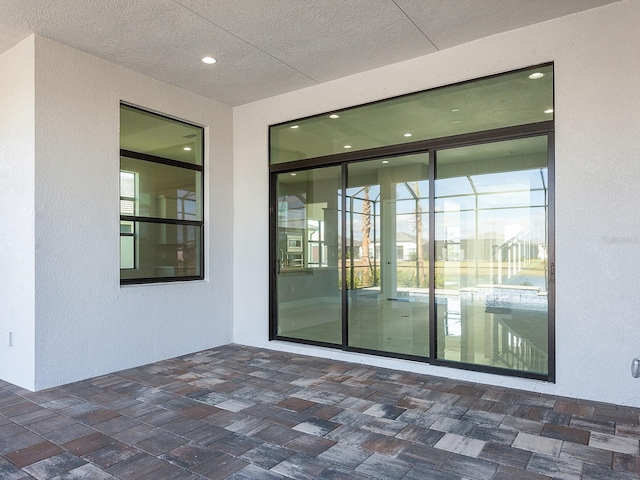 doorway to property with a patio