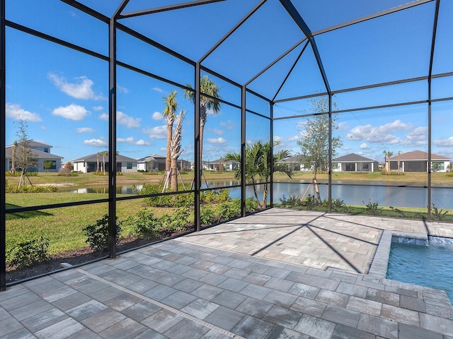 unfurnished sunroom with a water view