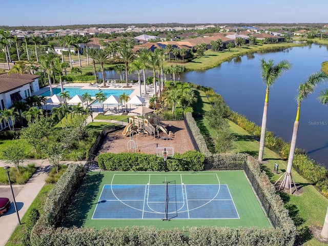 birds eye view of property with a water view