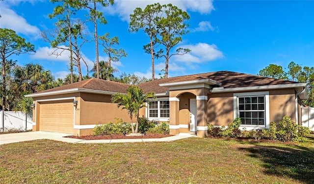 view of front of property with a front lawn and a garage