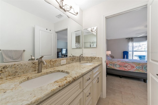 bathroom featuring tile patterned flooring, vanity, and ceiling fan