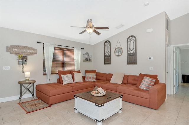 tiled living room featuring ceiling fan and vaulted ceiling