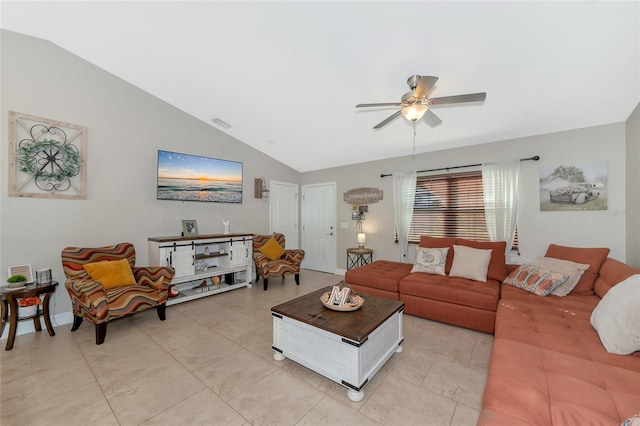 tiled living room featuring ceiling fan and lofted ceiling