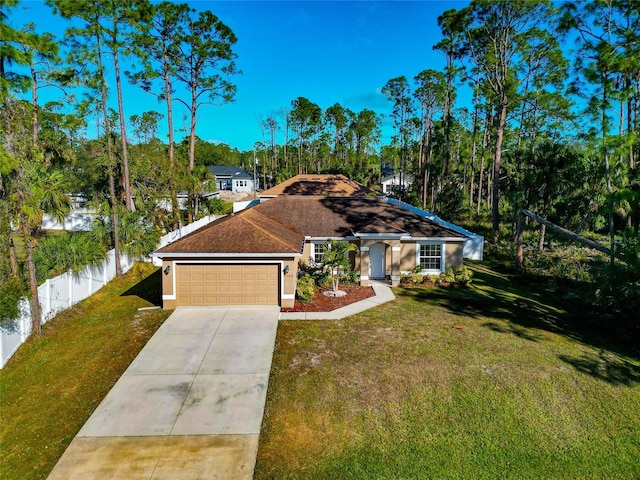 ranch-style home with a front yard and a garage