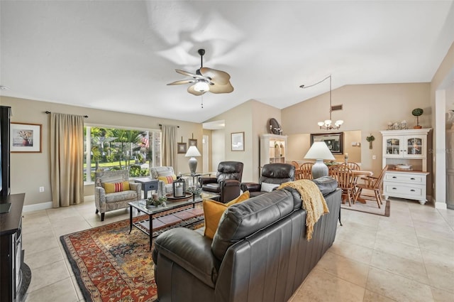 living room featuring ceiling fan with notable chandelier, vaulted ceiling, and light tile patterned flooring