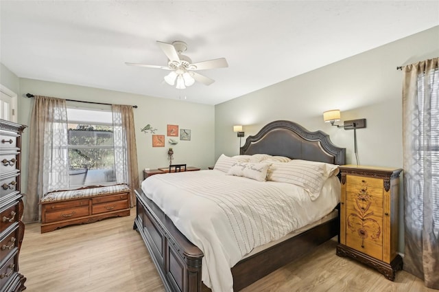 bedroom with ceiling fan and light hardwood / wood-style floors