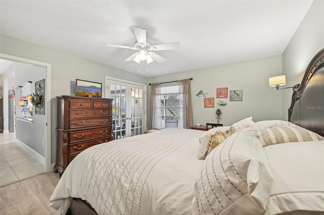 bedroom featuring ceiling fan, french doors, and light hardwood / wood-style flooring