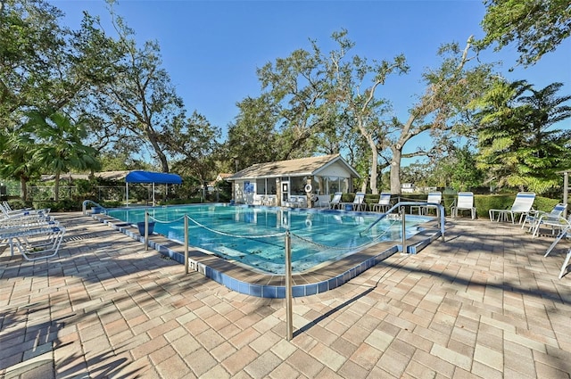 view of pool featuring a patio