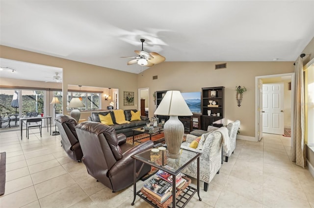 tiled living room featuring ceiling fan and vaulted ceiling