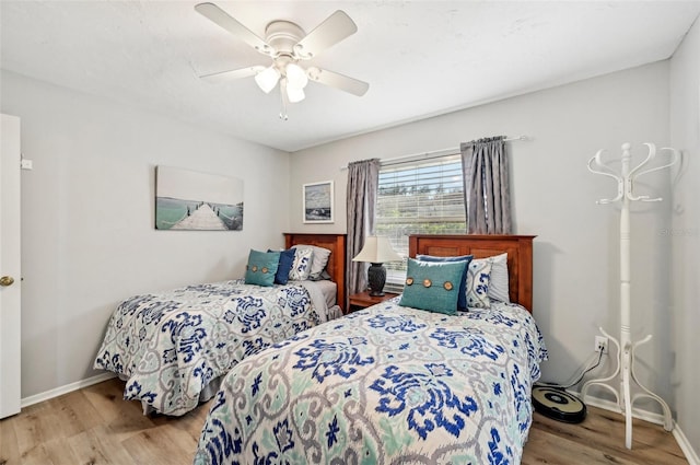 bedroom featuring ceiling fan and light hardwood / wood-style flooring