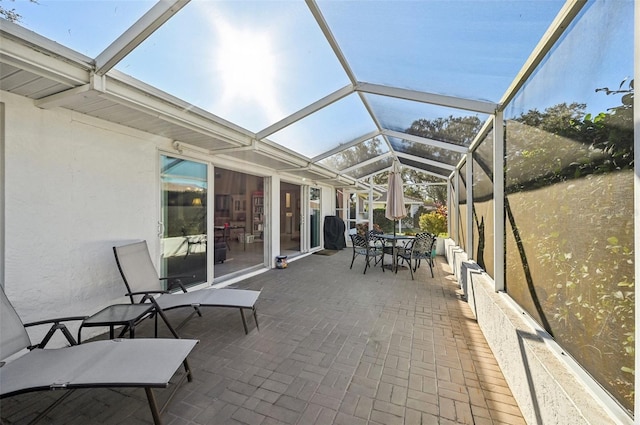 sunroom / solarium with vaulted ceiling