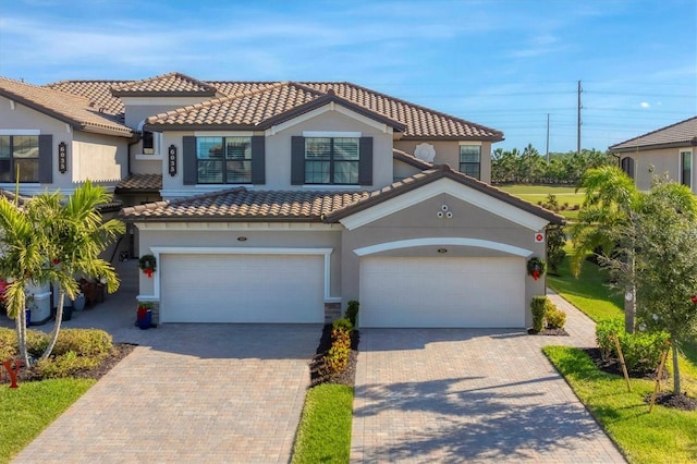 mediterranean / spanish-style house featuring a garage