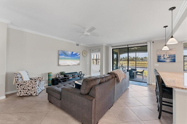 tiled living room featuring ceiling fan and ornamental molding