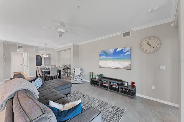 tiled living room with ceiling fan and ornamental molding