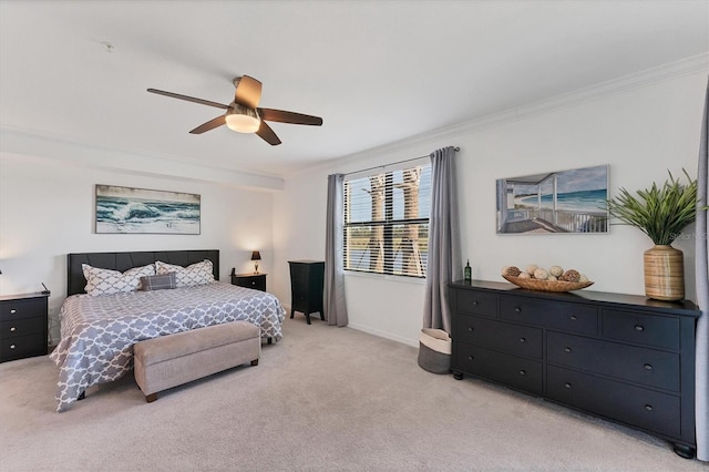 bedroom featuring light carpet, ceiling fan, and crown molding