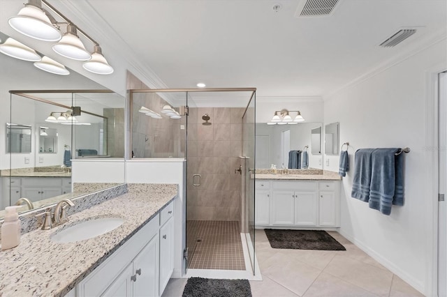 bathroom featuring tile patterned flooring, vanity, ornamental molding, and walk in shower