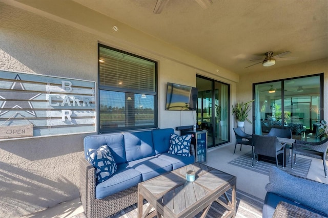 view of patio with an outdoor living space and ceiling fan