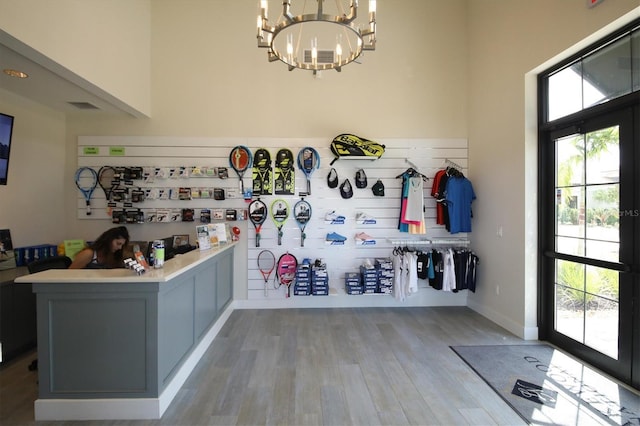 interior space with hardwood / wood-style flooring and an inviting chandelier