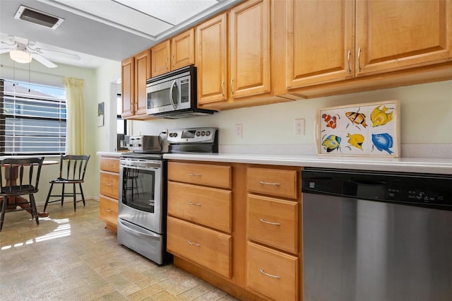 kitchen featuring appliances with stainless steel finishes and ceiling fan