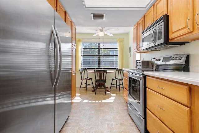 kitchen with stainless steel appliances and ceiling fan