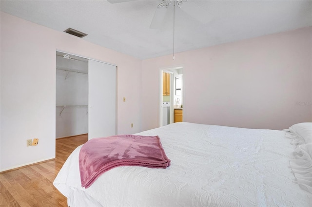 bedroom featuring hardwood / wood-style floors, a closet, and ceiling fan