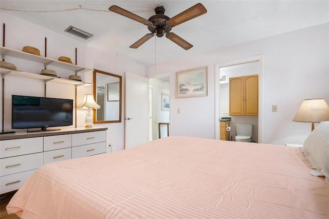 bedroom featuring ceiling fan and ensuite bath