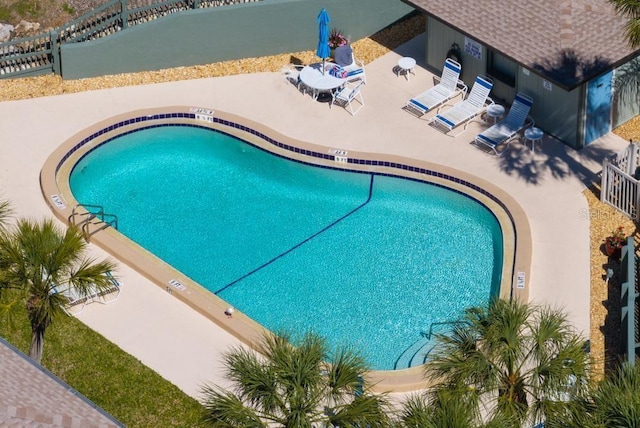 view of swimming pool with a patio area