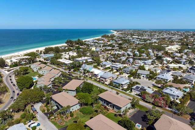 aerial view with a view of the beach and a water view