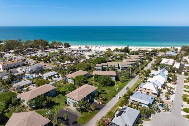 aerial view featuring a residential view, a water view, and a beach view