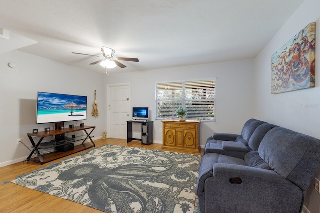 living room with ceiling fan and wood-type flooring