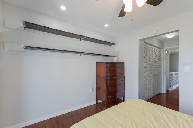 unfurnished bedroom featuring ceiling fan, dark wood-type flooring, and a closet