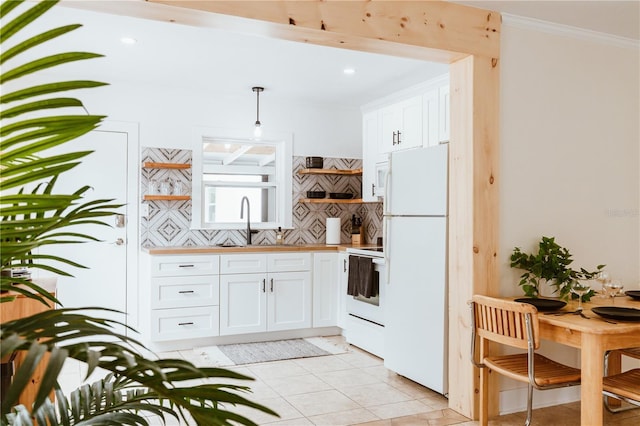 kitchen with white cabinetry, sink, tasteful backsplash, pendant lighting, and white appliances