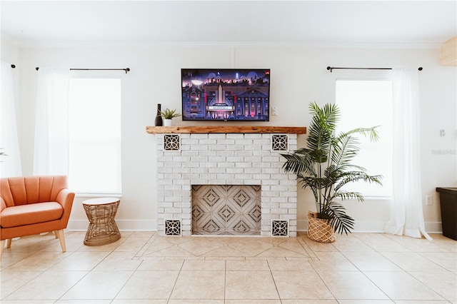 living room with tile patterned floors, a fireplace, and crown molding