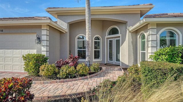 property entrance with a garage