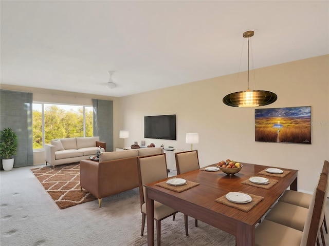 dining area with light colored carpet