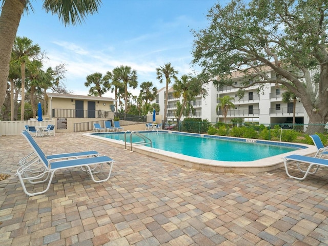 view of swimming pool with a patio area