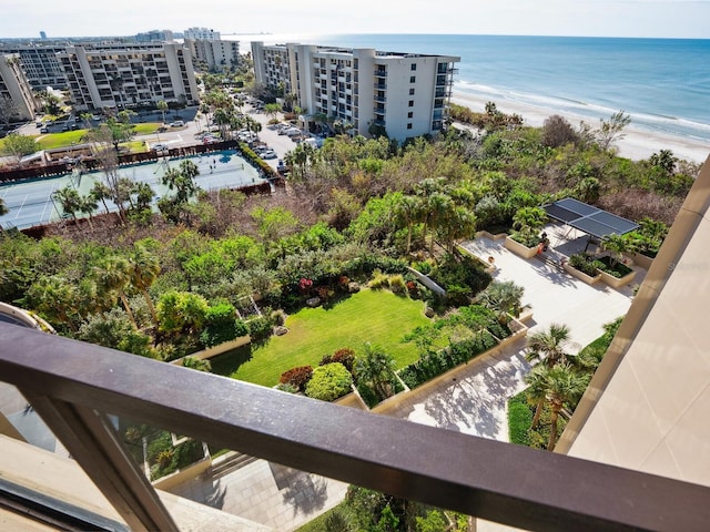 birds eye view of property with a beach view and a water view