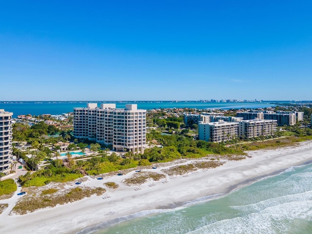 bird's eye view featuring a view of the beach and a water view