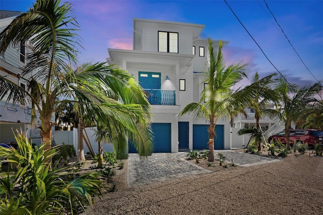 view of front of house with a balcony and a garage