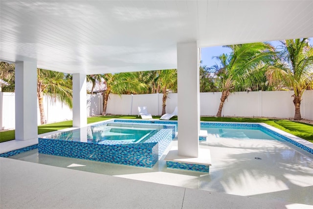 view of pool with an in ground hot tub