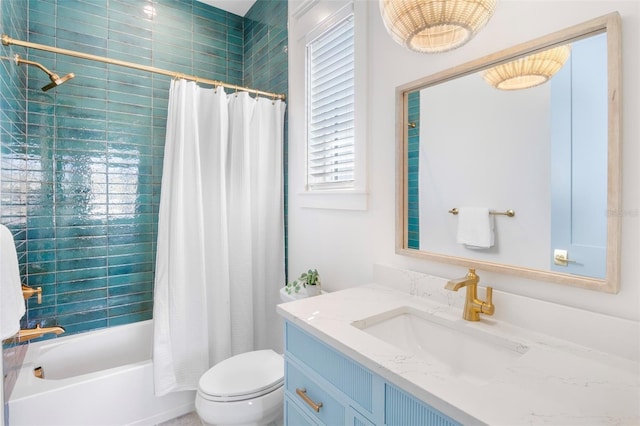 full bathroom featuring vanity, shower / tub combo, and toilet