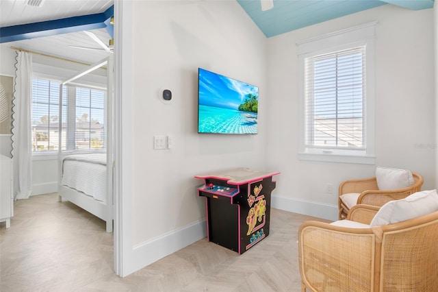 living area featuring wood ceiling and vaulted ceiling