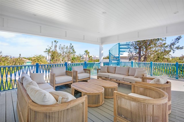 wooden deck featuring an outdoor living space