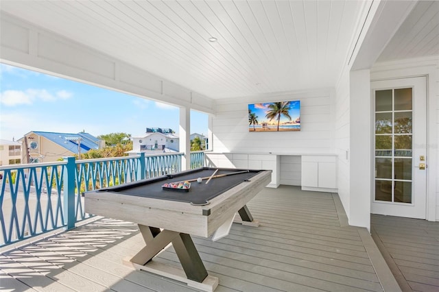 game room with hardwood / wood-style floors, wood ceiling, wood walls, and pool table