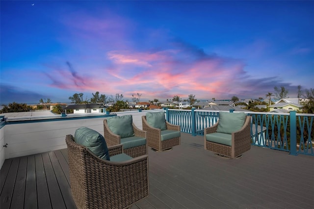 deck at dusk featuring an outdoor living space